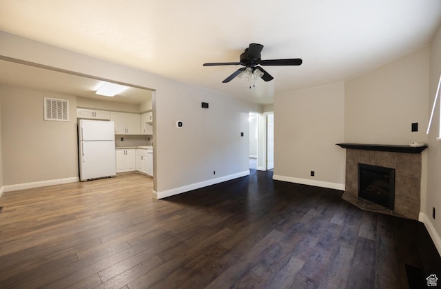 240 E 400 N Unit 28, Logan, UT 84321 - unfurnished living room featuring dark wood-type flooring, a fireplace, and ceiling fan