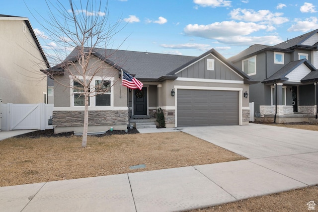 1769 W Valcrest Dr, Saratoga Springs, UT 84045 - craftsman-style house featuring stone siding, a gate, concrete driveway, an attached garage, and board and batten siding