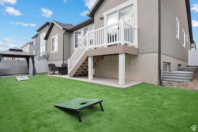 1769 W Valcrest Dr, Saratoga Springs, UT 84045 - back of house with a patio, a gazebo, stucco siding, and a wooden deck