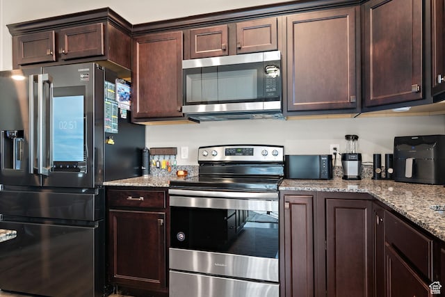 1769 W Valcrest Dr, Saratoga Springs, UT 84045 - kitchen featuring stainless steel appliances, dark brown cabinets, and light stone countertops