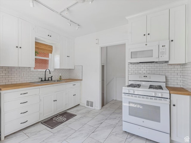 1332 S 200 E, Salt Lake City, UT 84115 - kitchen with white appliances, butcher block counters, white cabinetry, backsplash, and light marble finish floors