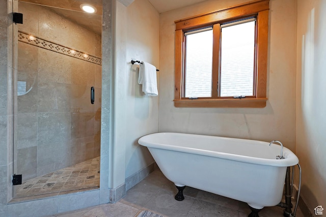 427 N J St E, Salt Lake City, UT 84103 - bathroom with a stall shower, a soaking tub, and tile patterned floors