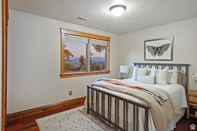 427 N J St E, Salt Lake City, UT 84103 - bedroom featuring wood finished floors and a textured ceiling