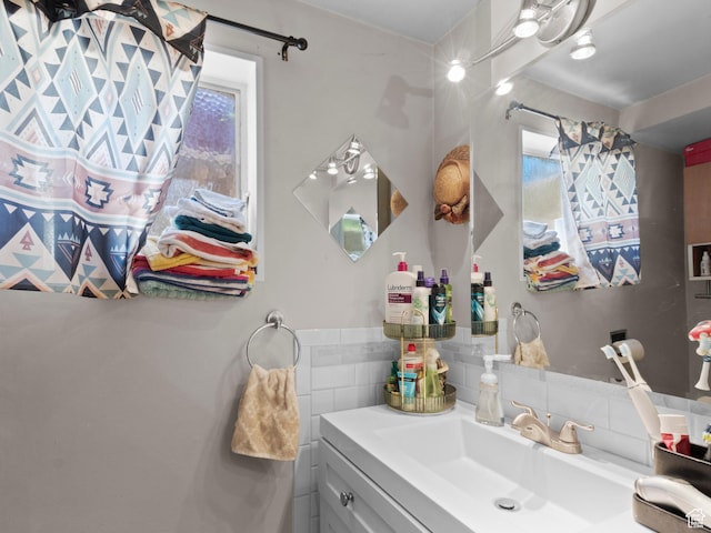 3018 E 4430 S, Salt Lake City, UT 84124 - bathroom with vanity, healthy amount of natural light, and tasteful backsplash