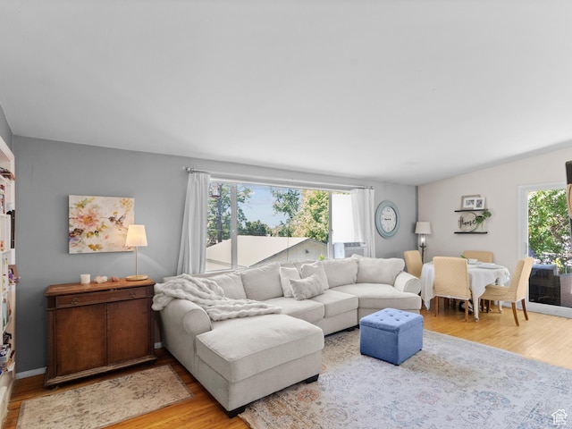 3018 E 4430 S, Salt Lake City, UT 84124 - living area with light wood finished floors and cooling unit