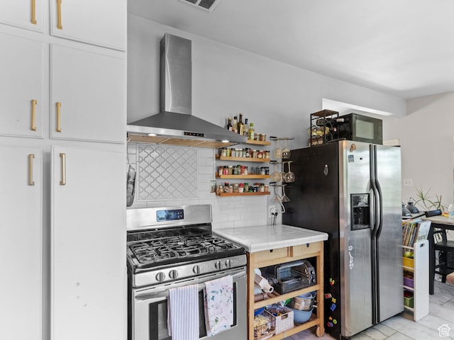 3018 E 4430 S, Salt Lake City, UT 84124 - kitchen with wall chimney exhaust hood, appliances with stainless steel finishes, decorative backsplash, white cabinetry, and tile counters
