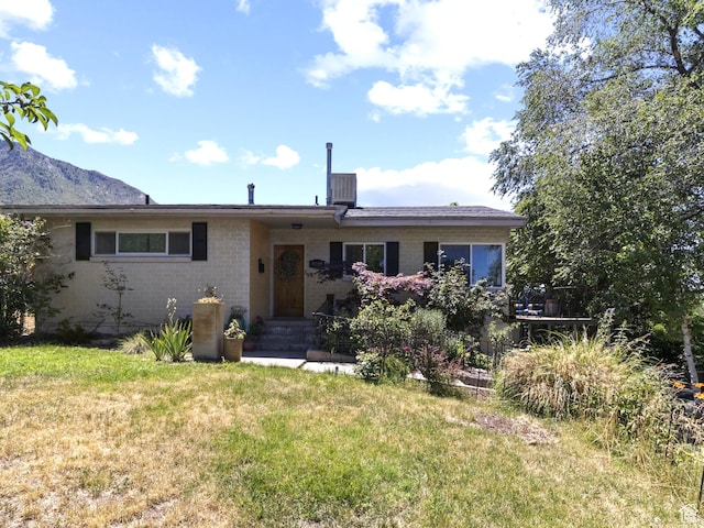 3018 E 4430 S, Salt Lake City, UT 84124 - view of front of property with a front lawn and a mountain view