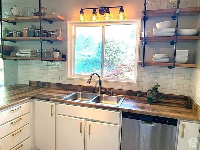 3018 E 4430 S, Salt Lake City, UT 84124 - kitchen featuring dishwasher, open shelves, white cabinetry, and tasteful backsplash