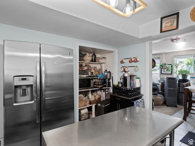 3018 E 4430 S, Salt Lake City, UT 84124 - kitchen featuring appliances with stainless steel finishes, stainless steel countertops, and light tile patterned floors