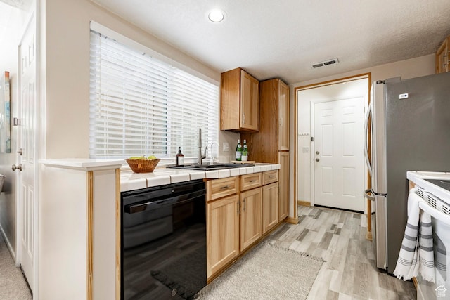 5441 S Spinnaker Row, Taylorsville, UT 84123 - kitchen with black dishwasher, light wood-style floors, tile countertops, and white electric stove