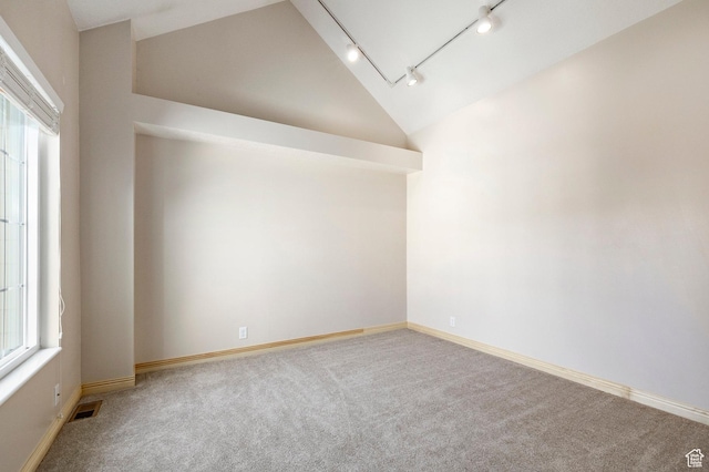 5441 S Spinnaker Row, Taylorsville, UT 84123 - spare room with rail lighting, vaulted ceiling, carpet, and attic access