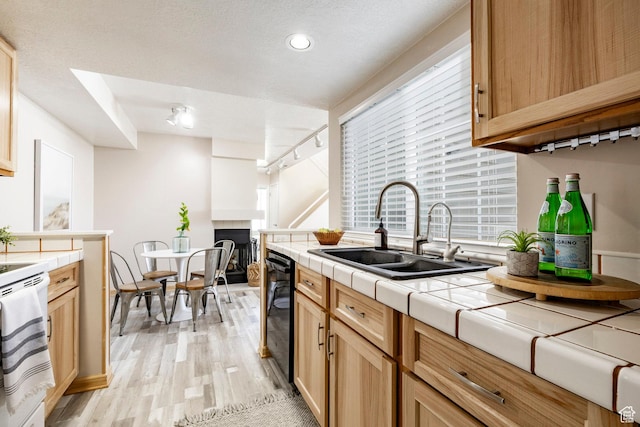 5441 S Spinnaker Row, Taylorsville, UT 84123 - kitchen with tile countertops, dishwasher, light wood finished floors, electric stove, and light brown cabinets