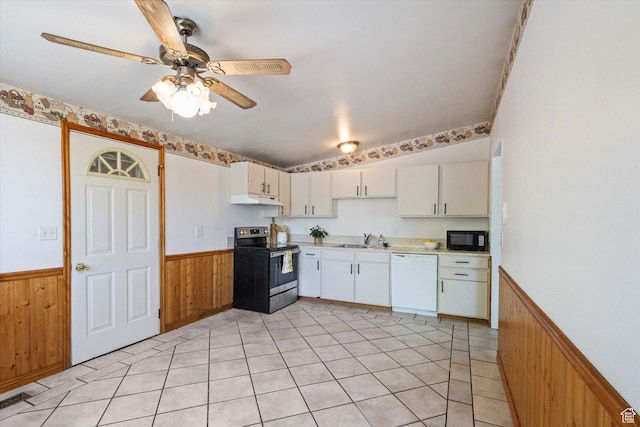 6709 W 3860 S, West Valley City, UT 84128 - kitchen with dishwasher, electric stove, black microwave, a wainscoted wall, and under cabinet range hood