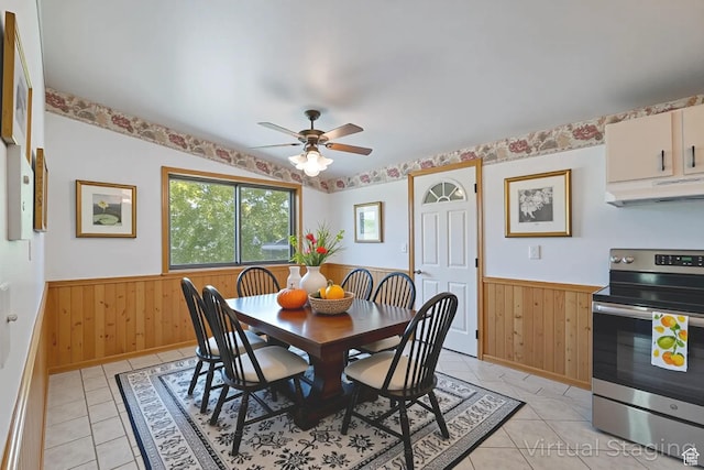 6709 W 3860 S, West Valley City, UT 84128 - dining room with a wainscoted wall, light tile patterned flooring, a ceiling fan, and wood walls