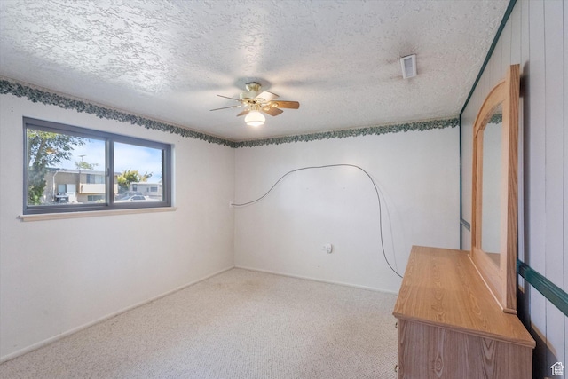 6709 W 3860 S, West Valley City, UT 84128 - spare room with ceiling fan, carpet, and a textured ceiling