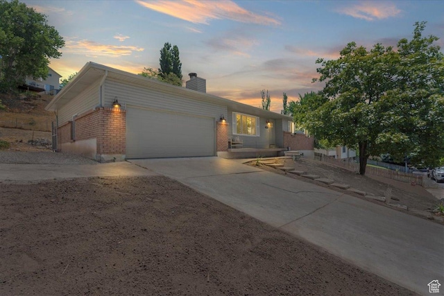 787 S 1680 E, Pleasant Grove, UT 84062 - ranch-style house featuring an attached garage, driveway, a chimney, and brick siding