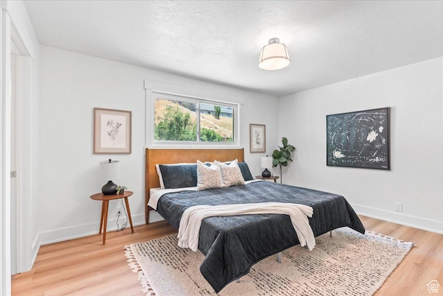 787 S 1680 E, Pleasant Grove, UT 84062 - bedroom with light wood-type flooring and a textured ceiling