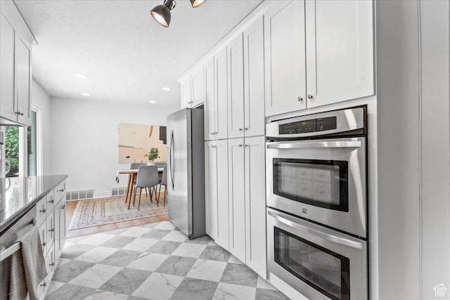 787 S 1680 E, Pleasant Grove, UT 84062 - kitchen with appliances with stainless steel finishes, light stone countertops, white cabinetry, and recessed lighting