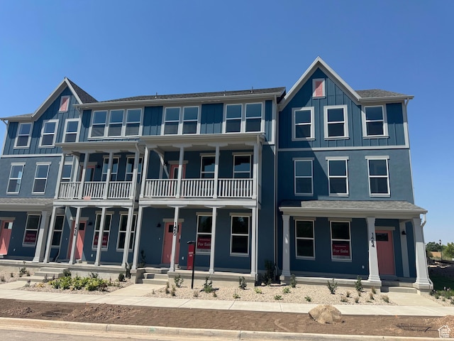 1456 N 1875 W Unit 147, Layton, UT 84041 - view of front of property featuring covered porch, a balcony, and board and batten siding