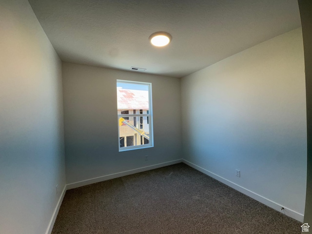 1456 N 1875 W Unit 147, Layton, UT 84041 - spare room with dark colored carpet and baseboards