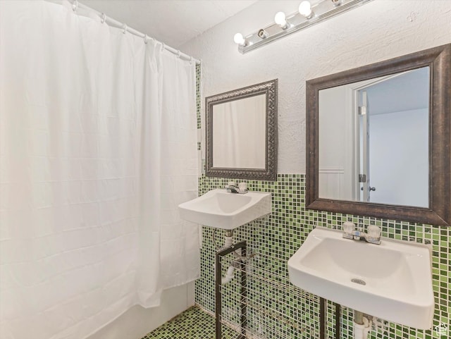 4049 E Dillons Dr N, Eagle Mountain, UT 84005 - bathroom with curtained shower, tile walls, and backsplash