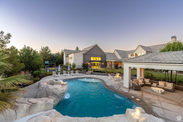 2916 S 300 E, Washington, UT 84780 - pool at dusk featuring a patio and an outdoor hangout area
