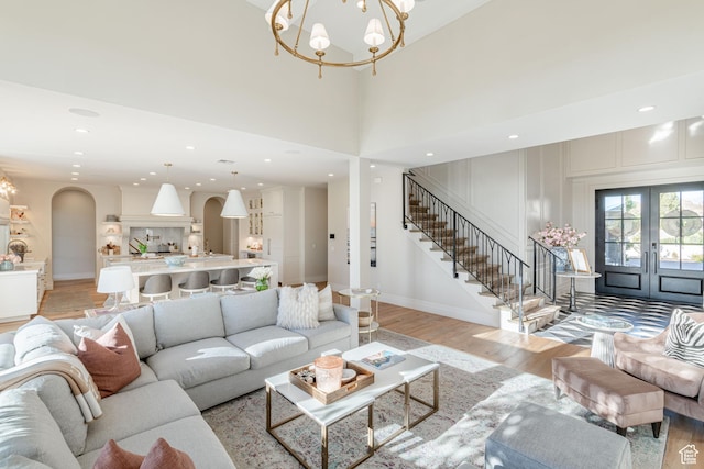 2916 S 300 E, Washington, UT 84780 - living area with french doors, light wood-style floors, a chandelier, stairway, and recessed lighting