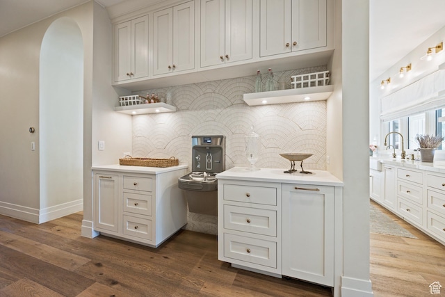 2916 S 300 E, Washington, UT 84780 - kitchen with open shelves, tasteful backsplash, arched walkways, and light countertops