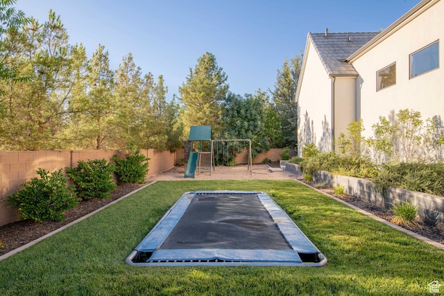 2916 S 300 E, Washington, UT 84780 - fenced backyard featuring a trampoline and a playground