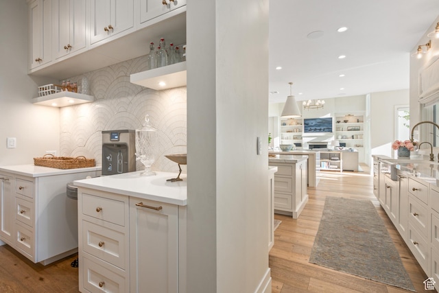 2916 S 300 E, Washington, UT 84780 - kitchen featuring light wood-style flooring, recessed lighting, light countertops, and white cabinets