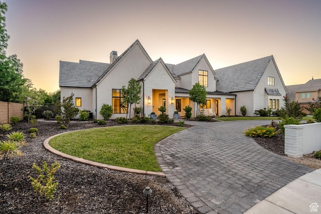 2916 S 300 E, Washington, UT 84780 - view of front of house with curved driveway, stucco siding, a chimney, a standing seam roof, and a metal roof
