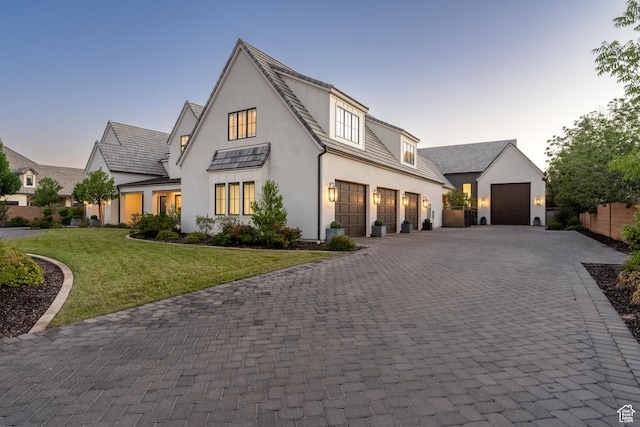 2916 S 300 E, Washington, UT 84780 - modern farmhouse with decorative driveway, stucco siding, a front yard, and an outbuilding