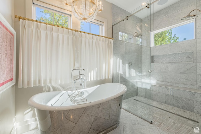 2916 S 300 E, Washington, UT 84780 - bathroom featuring a chandelier, healthy amount of natural light, a soaking tub, and a stall shower