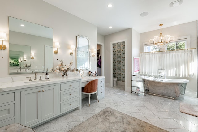2916 S 300 E, Washington, UT 84780 - full bathroom featuring vanity, a chandelier, a soaking tub, recessed lighting, and a walk in closet