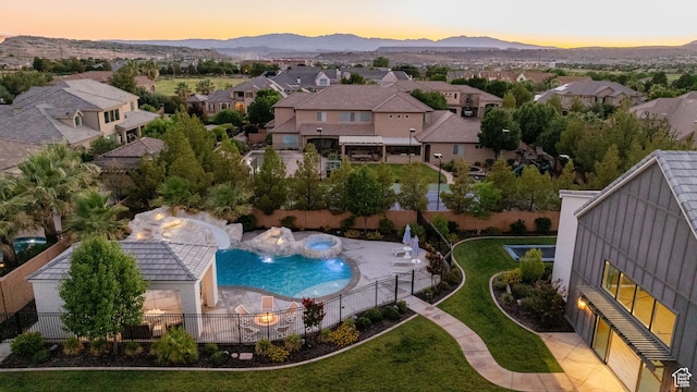 2916 S 300 E, Washington, UT 84780 - aerial perspective of suburban area with a pool and a mountainous background