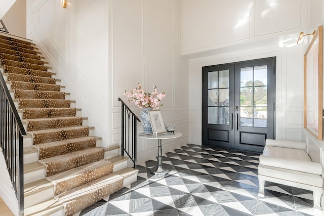 2916 S 300 E, Washington, UT 84780 - foyer entrance featuring a decorative wall, stairway, and french doors