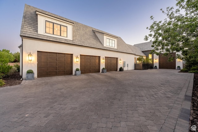 2916 S 300 E, Washington, UT 84780 - view of front facade with decorative driveway, stucco siding, and a garage