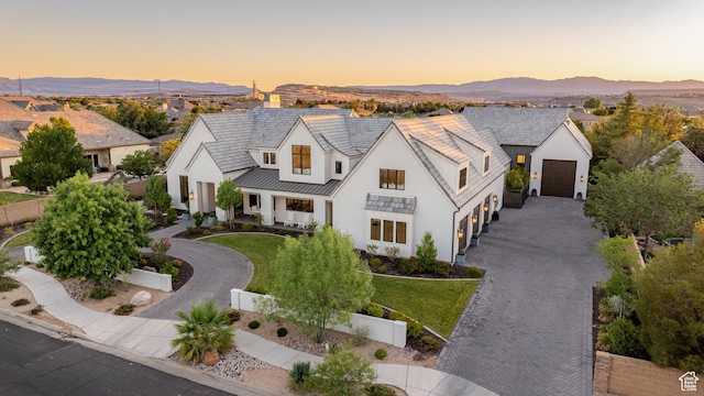 2916 S 300 E, Washington, UT 84780 - modern farmhouse style home featuring driveway, stucco siding, a standing seam roof, a mountain view, and a metal roof