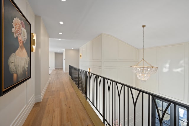 2916 S 300 E, Washington, UT 84780 - hall featuring a chandelier, a decorative wall, light wood finished floors, recessed lighting, and an upstairs landing