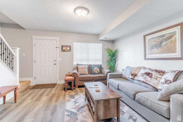 287 E 2300 N Unit 30, North Ogden, UT 84414 - living area with light wood-style floors and stairway