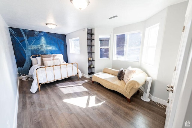 7390 N Pawnee Rd, Eagle Mountain, UT 84005 - bedroom with an accent wall and wood finished floors