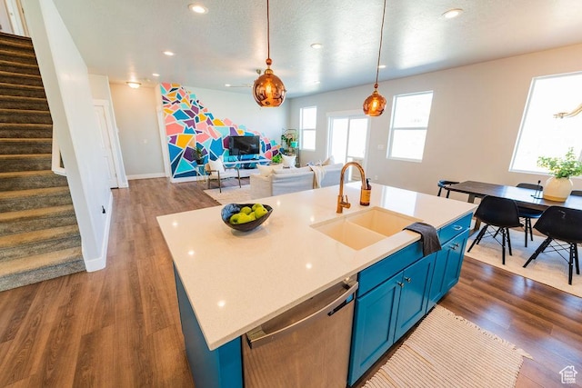7390 N Pawnee Rd, Eagle Mountain, UT 84005 - kitchen featuring blue cabinetry, dishwasher, open floor plan, dark wood-type flooring, and recessed lighting