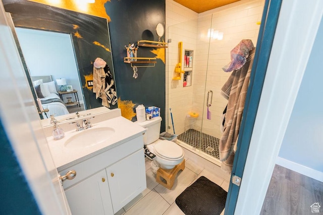 7390 N Pawnee Rd, Eagle Mountain, UT 84005 - bathroom with a shower stall, vanity, and wood finished floors