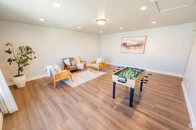 7390 N Pawnee Rd, Eagle Mountain, UT 84005 - rec room with light wood-type flooring, recessed lighting, and attic access