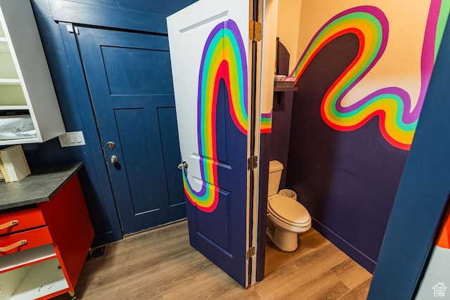 7390 N Pawnee Rd, Eagle Mountain, UT 84005 - bathroom with wood finished floors and toilet