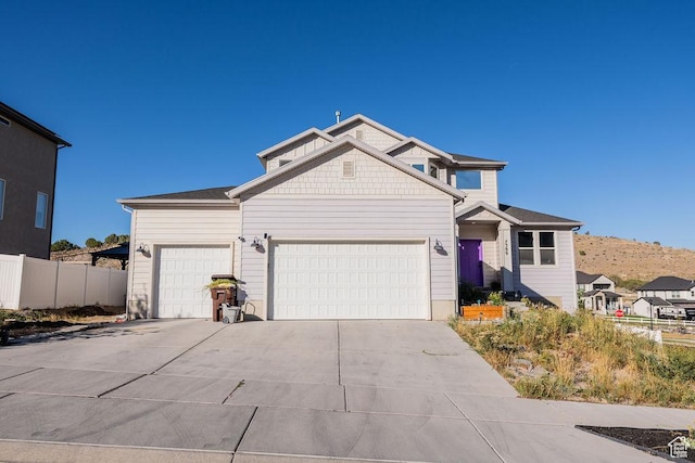 7390 N Pawnee Rd, Eagle Mountain, UT 84005 - view of front facade featuring an attached garage and driveway