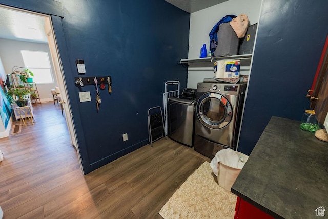 7390 N Pawnee Rd, Eagle Mountain, UT 84005 - laundry area with separate washer and dryer and wood finished floors