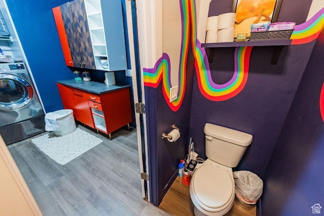 7390 N Pawnee Rd, Eagle Mountain, UT 84005 - bathroom featuring washer / clothes dryer and wood finished floors