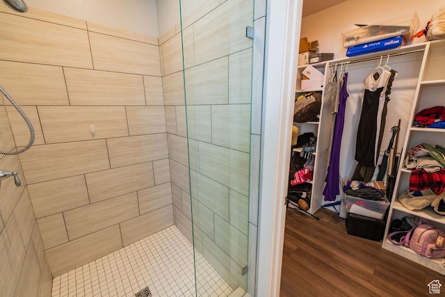7390 N Pawnee Rd, Eagle Mountain, UT 84005 - full bath with a shower stall, a spacious closet, and wood finished floors