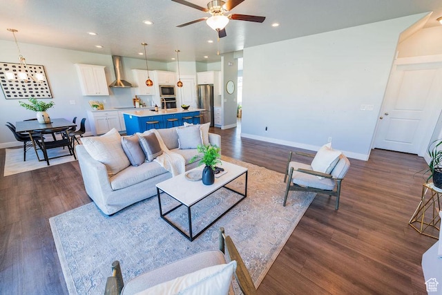 7390 N Pawnee Rd, Eagle Mountain, UT 84005 - living area featuring a ceiling fan, recessed lighting, and dark wood finished floors